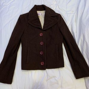 brown jacket with purple buttons